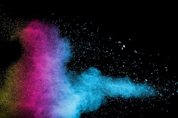 Abstract multicolored powder explosion on black background.