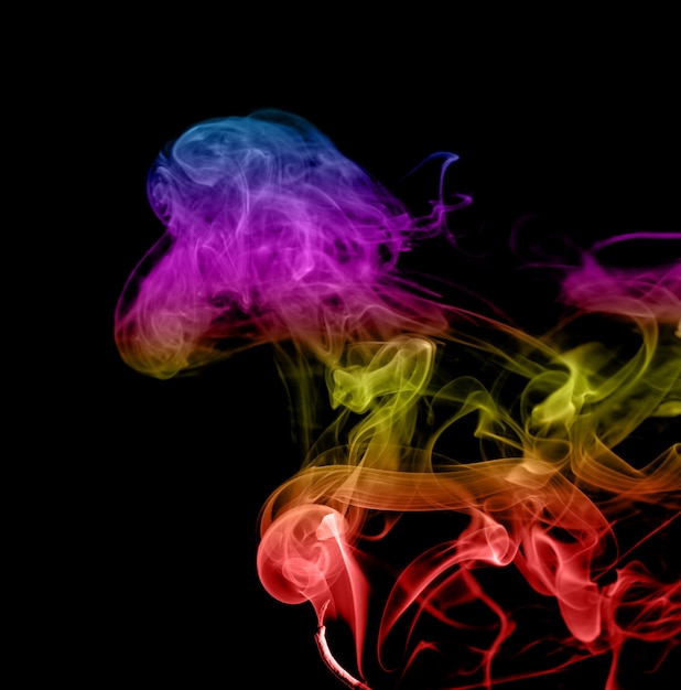 Abstract multicolored smoke on a dark background