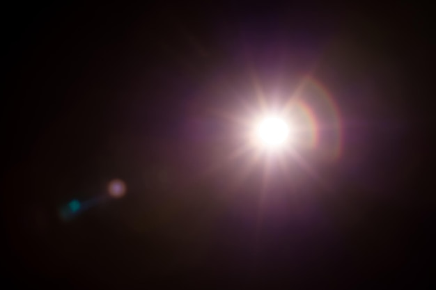 Photo abstract natural sun flare on the black