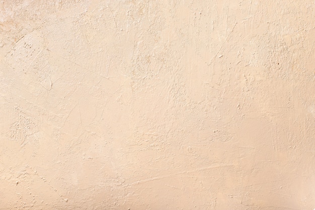 Abstract neutral beige wall. textured background. selective focus.