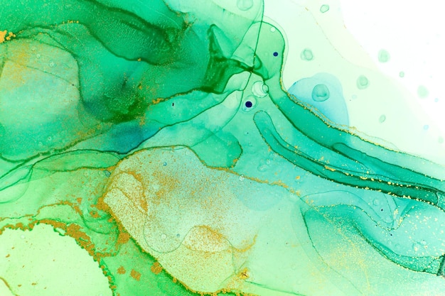 Abstract ocean foam print. Watercolor green and blue texture with gold glitter.