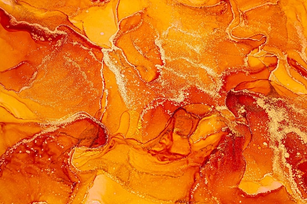 Abstract orange bright shiny color fluid background, hand drawn alcohol painting with golden streaks, liquid ink technique texture for backdrop design