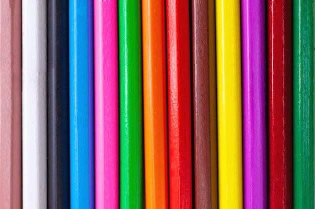 Abstract pattern background of wooden colored crayon pencils