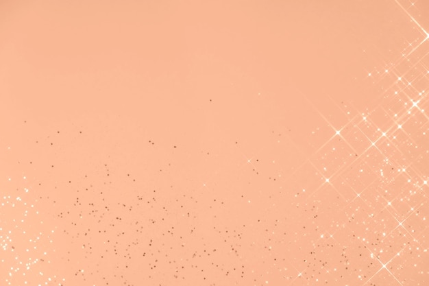 Abstract Peach Fuzz background with sparkles in the shape of stars