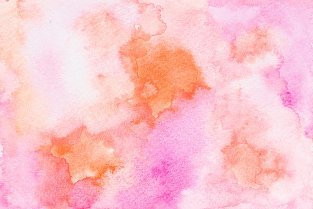 Abstract pink and orange watercolor painting on paper background