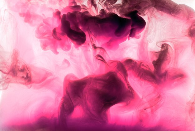 Abstract pink purple cloud of smoke, paint in water background