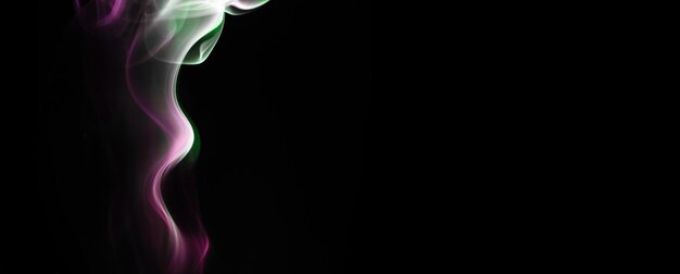 Abstract pink smoke on a black background banner photo