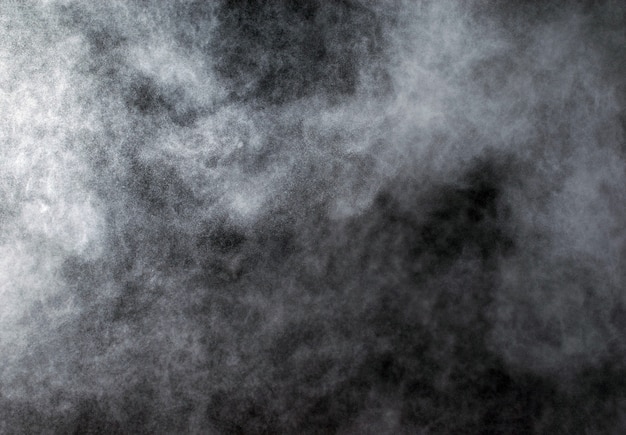 Abstract powder explosions isolated on black background.