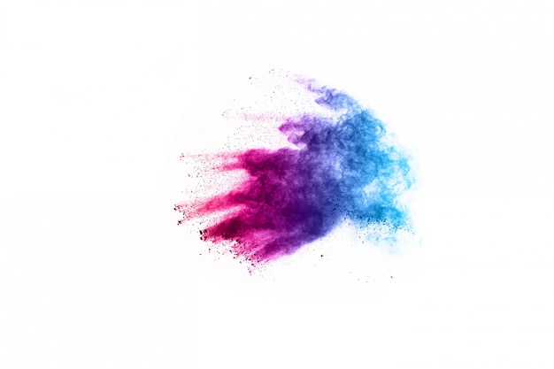 Abstract powder splatted background. Colorful powder explosion on white background. 