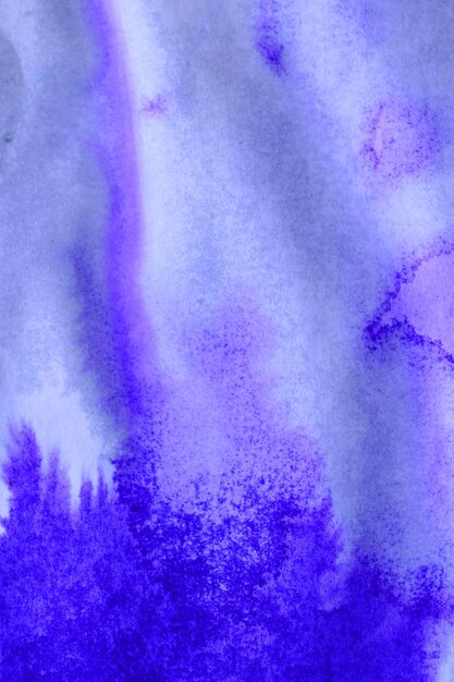 Abstract purple ink stains with streaks on white wet paper