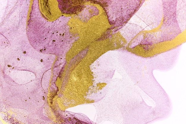 Abstract purple stains on white. Violet and gold watercolor ink pattern.