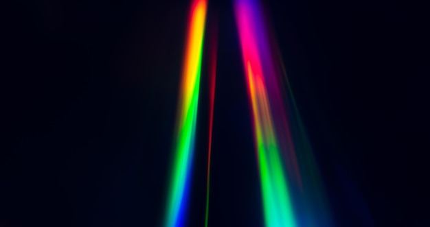 Abstract Rainbow light trails on the dark background