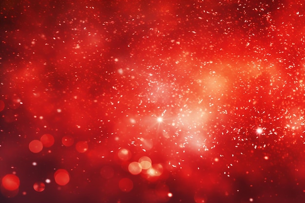 an abstract red background with glowing lights and shiny stars