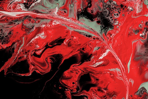 Abstract red fluid art with silver on a black background smooth streaks waves lines ebru design suminagashi