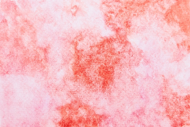 Abstract red and pink watercolor background. It is drawn by hand.