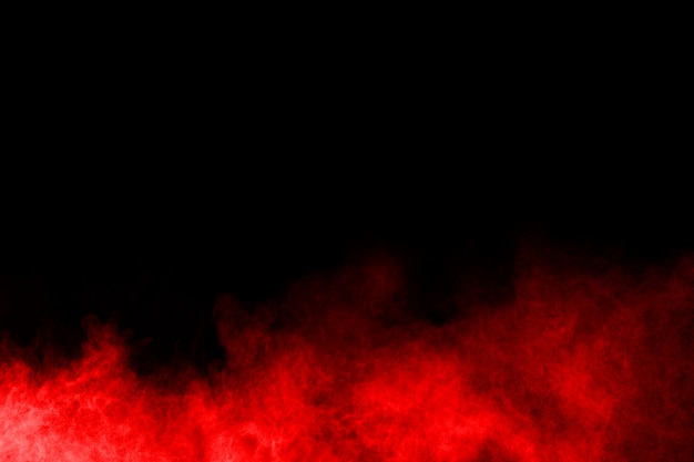 abstract red powder splatted on black background.  