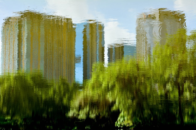 Abstract reflection of tree and building on the water