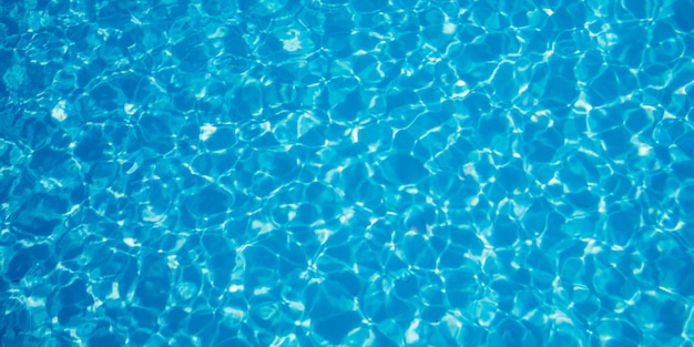 写真 青い放射状テクスチャーリップル背景付きのスイミングプールで抽象的な破れた水