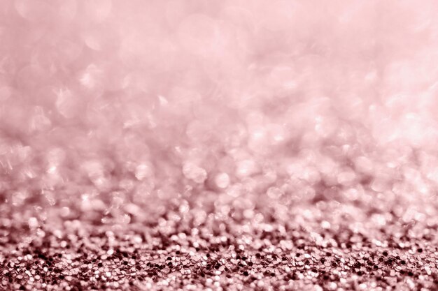 Abstract rose gold glitter sparkle texture with bokeh background