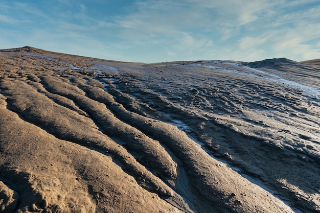 Abstract shapes on ground created by mud volcanoes lava, Romania