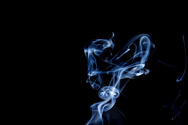 Abstract smoke of joss stickon black background