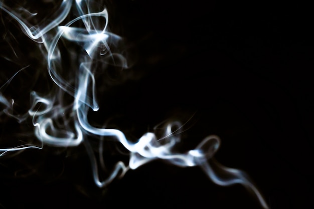 Abstract smoke line movement with white light effect on black background