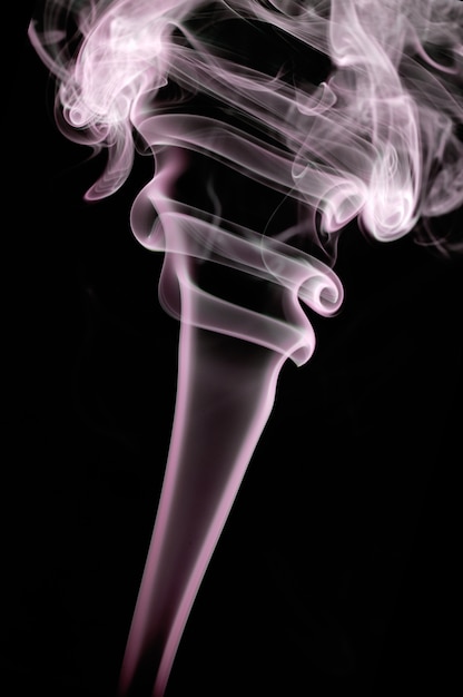 Abstract smoke shapes over a black background