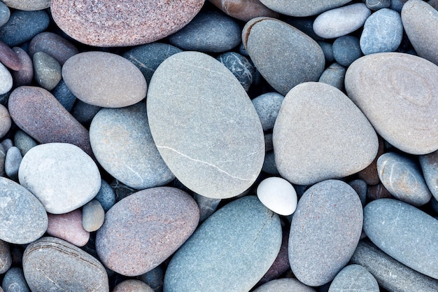 Abstract smooth round pebbles sea texture background