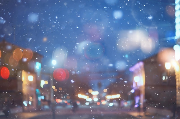 abstract snow blurred background city lights, winter holiday new year