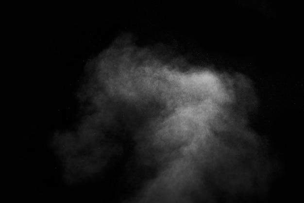 Abstract steam with dots of spray moves on a black background. Figured smoke can be used for design.