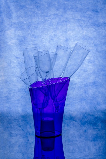 Photo abstract still life with transparent objects on blue background