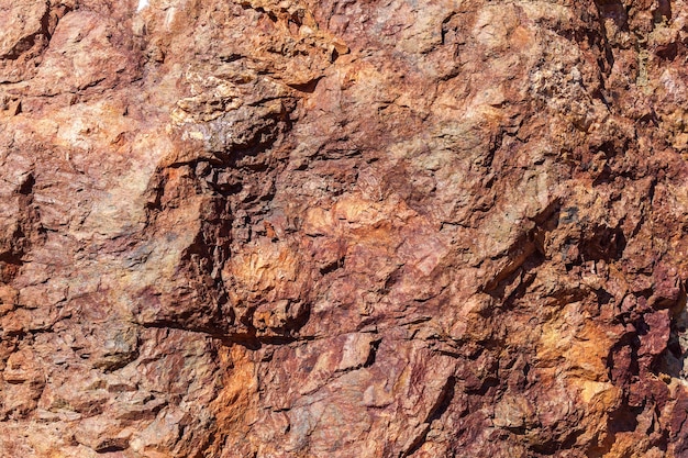 Abstract of stone.Background of rough surfaced of natural red stones.