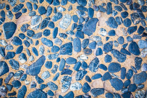 Foto pavimento in pietra astratto per carta da parati di sfondo o rivestimento in pelle pietre di mare sfondo pietra naturale per la trama dello sfondo dell'immagine decorativa