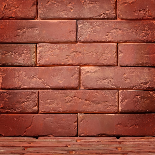 Abstract surface of an old red brick.