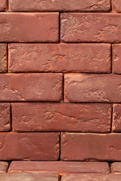 Photo abstract surface of an old red brick.