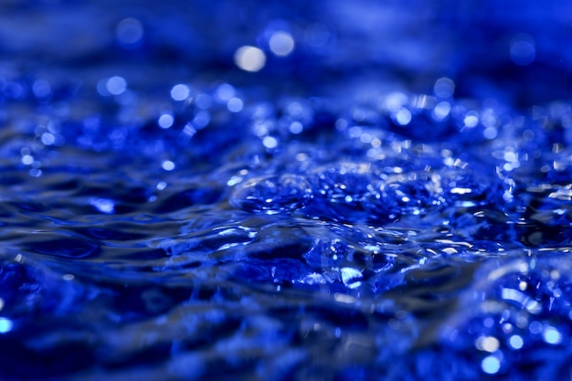 Abstract texture art blue water background with air bubbles close-up macro photography