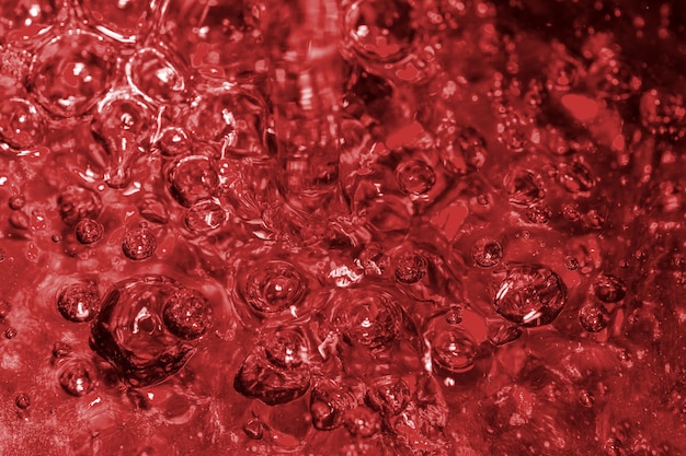 Abstract texture art red water background with air bubbles close-up macro photography