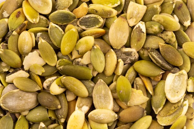 Abstract texture of pumpkin seeds macro close-up background at close range