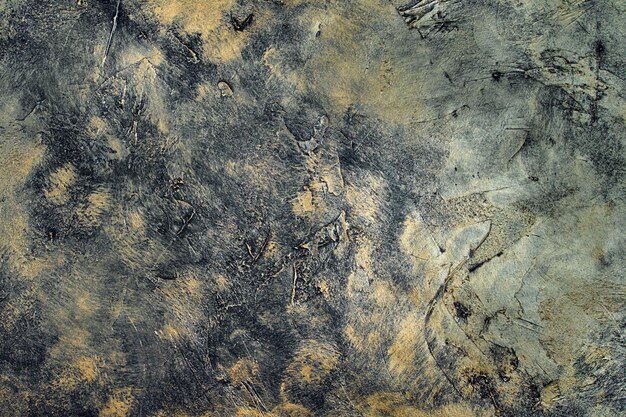 Фото Абстрактный текстурированный фон в черном и сером с золотом
