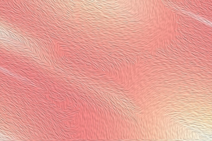 Photo abstract textured background in shades of pink and orange