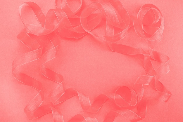 Abstract textured coral background Ribbon curls top view