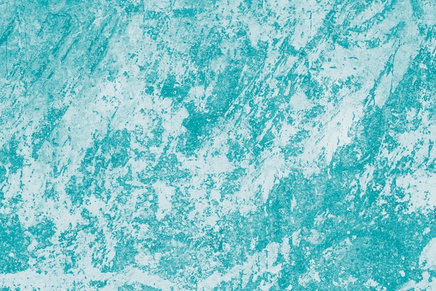 Abstract turquoise pattern with marbled effect. Green paint wall background.