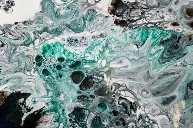 Photo abstract versicoloured background luxury fluid art waves splashes and blots of acrylic alcohol ink paints under water multicolored marble texture