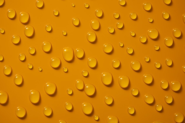 Photo abstract water drops on orange bronze background macro bubbles close up