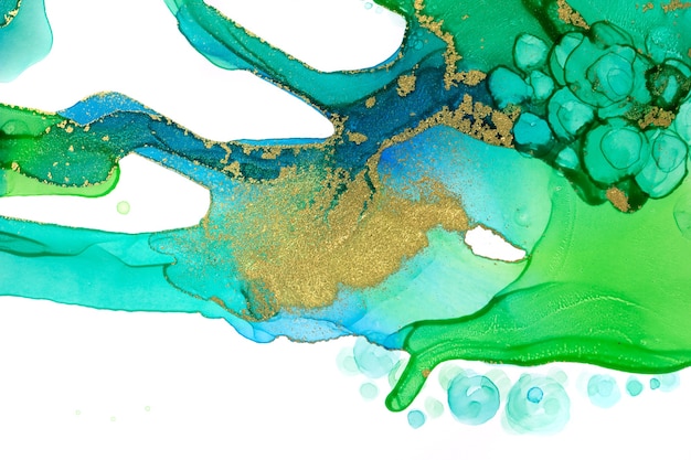 Abstract watercolor ink green and blue texture with gold glitter.