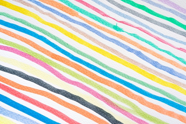 Abstract watercolor lines pattern background. Colorful watercolor painted brush strokes on white. Close-up.