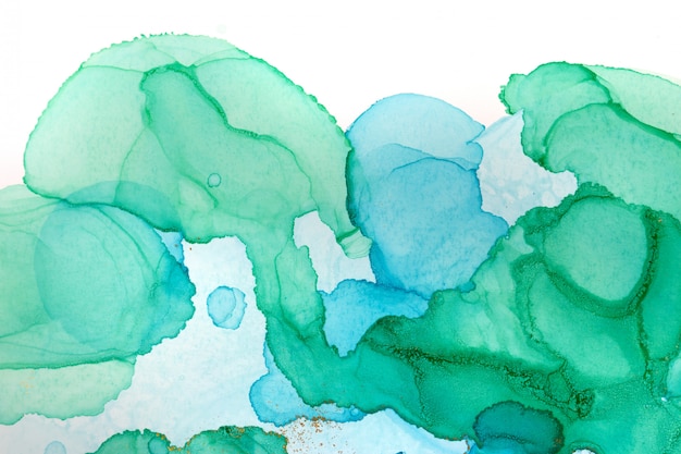 Abstract watercolor transparent drops background. Green, blue and golden glitter texture.