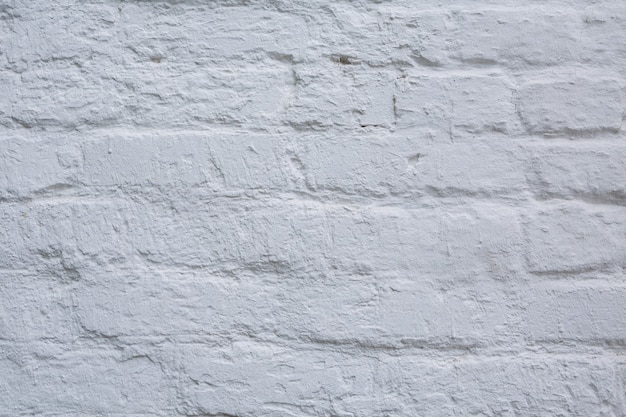 Abstract weathered texture white brick wall background