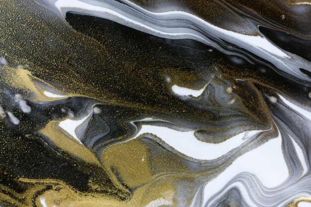 Abstract white and black texture with gold glitter