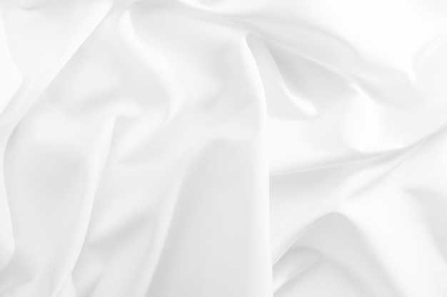 Abstract white fabric texture background. cloth soft wave. creases of satin, silk, and cotton.